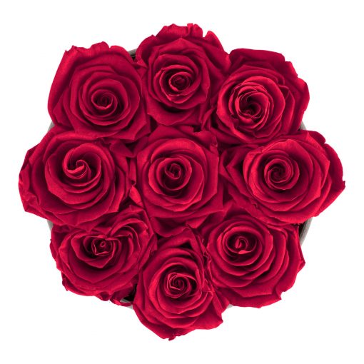 Runde Rosenbox aus hellgrauem Samt mit roten Infinityrosen von oben